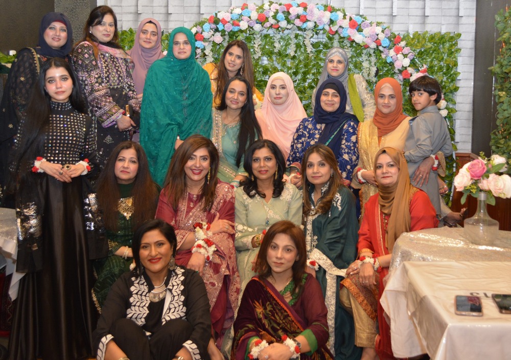 A group of women posing for a photo

AI-generated content may be incorrect.