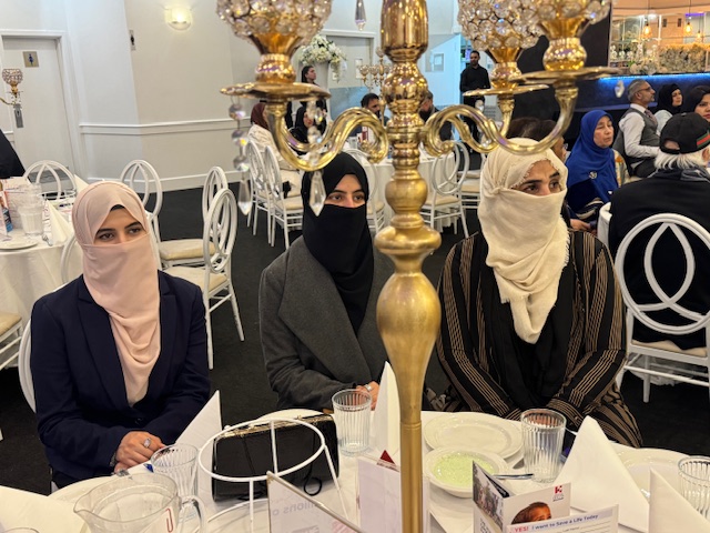 A group of women sitting at a table

AI-generated content may be incorrect.