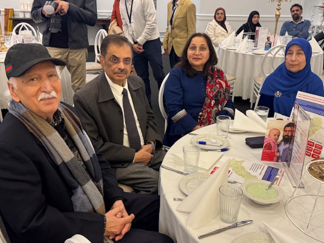 A group of people sitting at a table

AI-generated content may be incorrect.