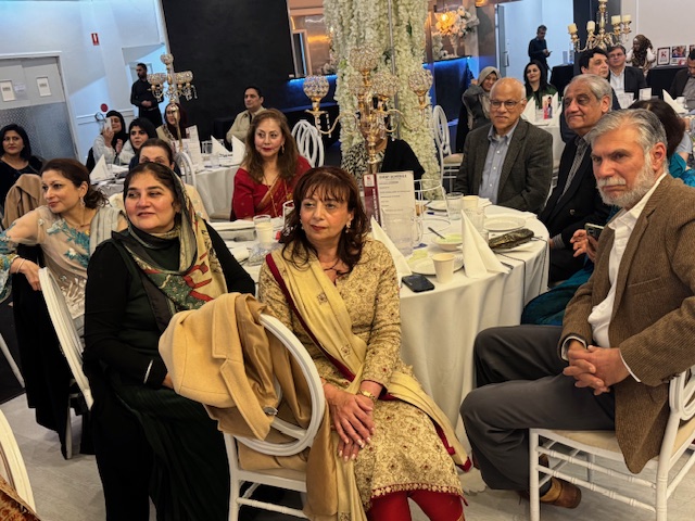 A group of people sitting at tables

AI-generated content may be incorrect.