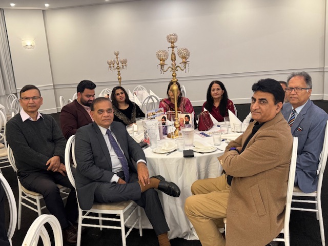 A group of people sitting at a table

AI-generated content may be incorrect.