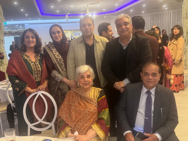 A group of people posing for a photo

AI-generated content may be incorrect.