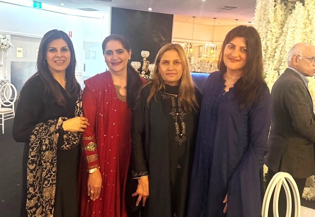 A group of women posing for a photo

AI-generated content may be incorrect.