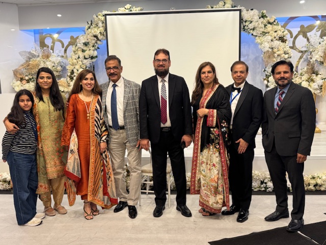 A group of people posing for a photo

AI-generated content may be incorrect.