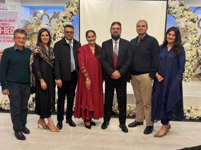 A group of people posing for a photo

AI-generated content may be incorrect.