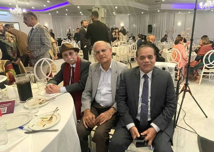 A group of men sitting at a table

AI-generated content may be incorrect.