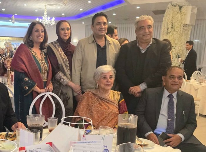 A group of people posing for a photo

AI-generated content may be incorrect.