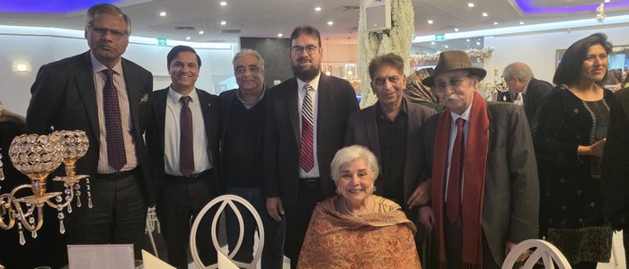 A group of people posing for a photo

AI-generated content may be incorrect.