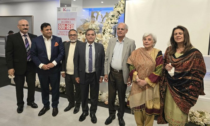 A group of people standing together

AI-generated content may be incorrect.