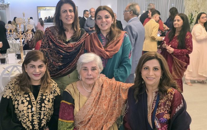 A group of women posing for a photo

AI-generated content may be incorrect.