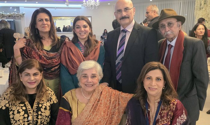 A group of people posing for a photo

AI-generated content may be incorrect.