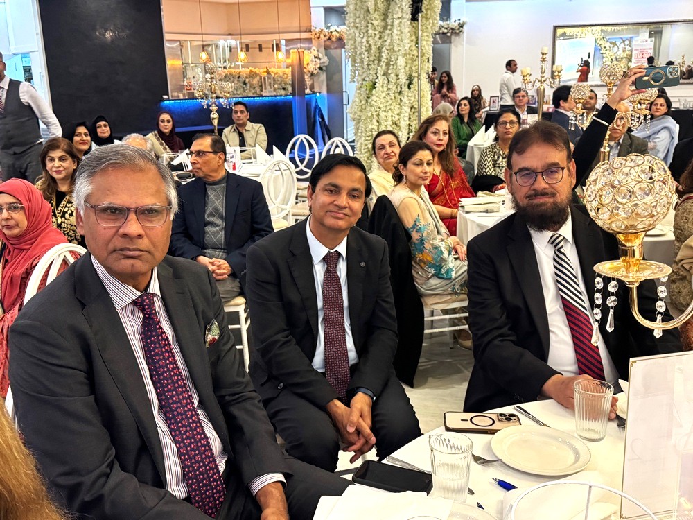 A group of men sitting at a table

AI-generated content may be incorrect.