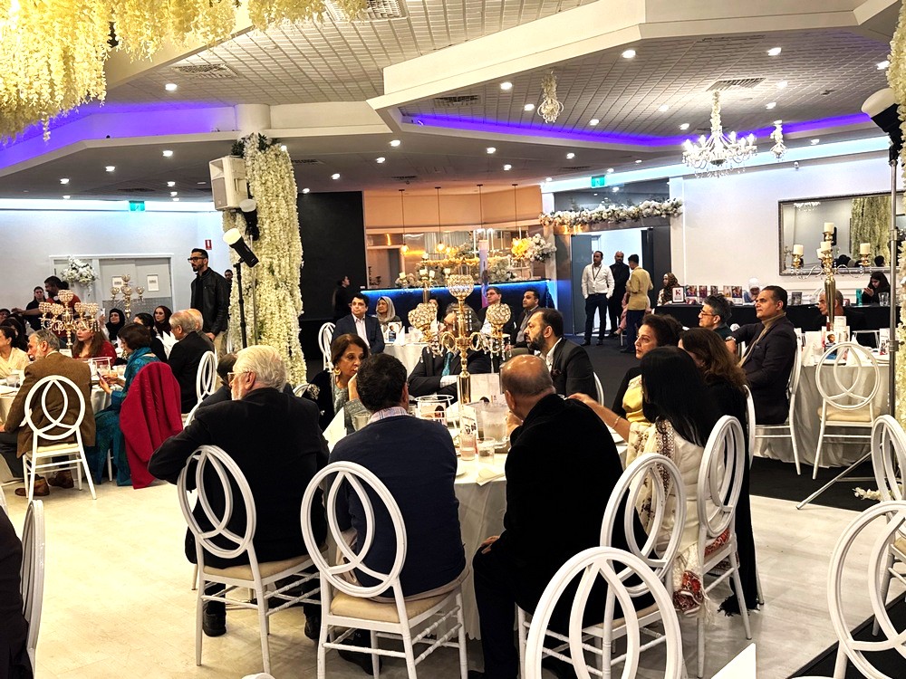 A group of people sitting around a table

AI-generated content may be incorrect.