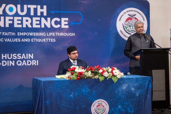 A group of men standing at a table

AI-generated content may be incorrect.