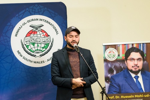 A person speaking into a microphone

AI-generated content may be incorrect.