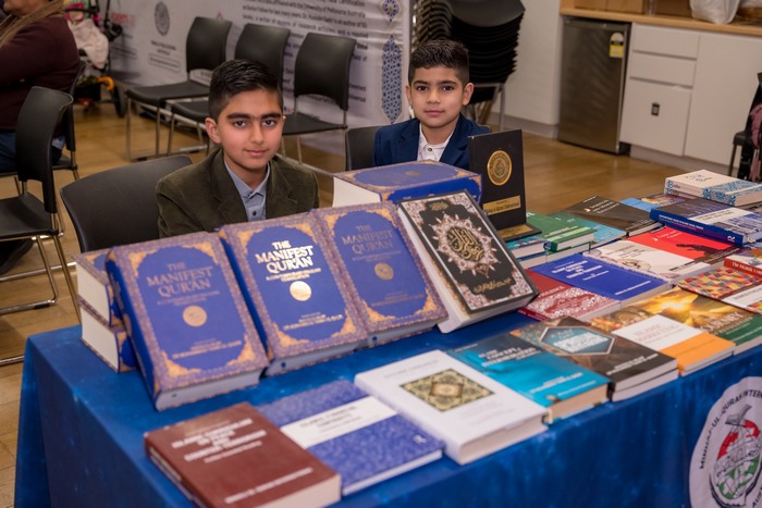 Two boys sitting at a table with books

AI-generated content may be incorrect.
