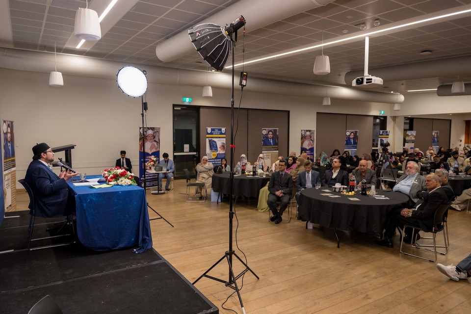 A group of people sitting around tables

AI-generated content may be incorrect.
