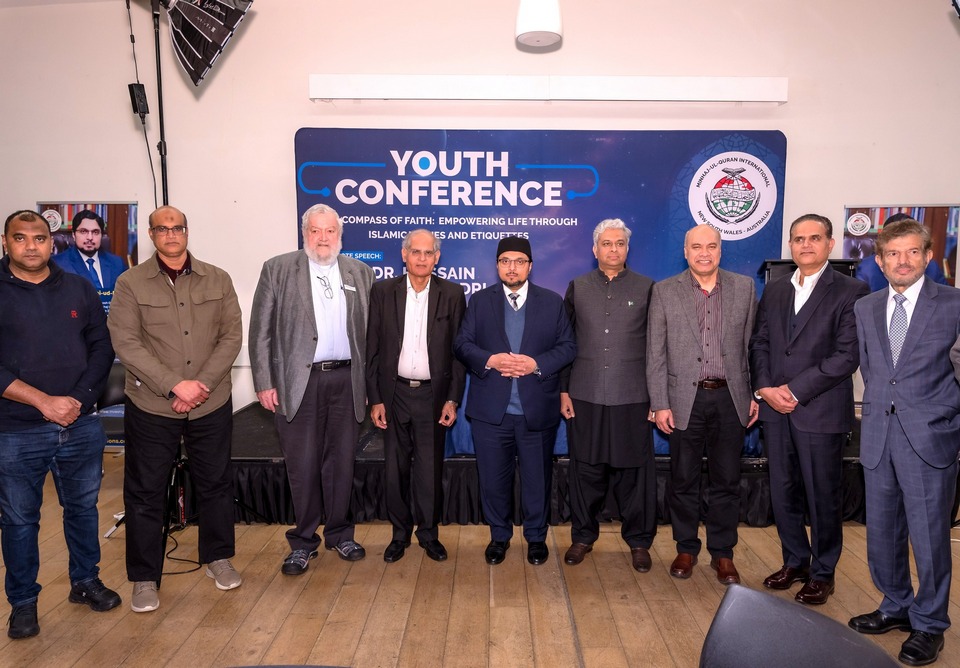 A group of men standing in front of a sign

AI-generated content may be incorrect.