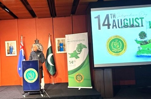 A person standing at a podium with a screen and a flag

AI-generated content may be incorrect.