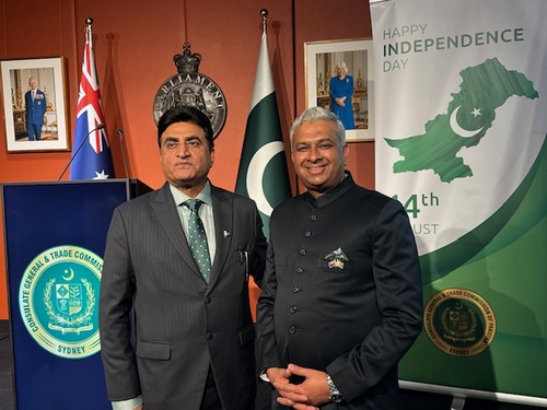 Two men standing in front of flags

AI-generated content may be incorrect.