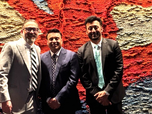 A group of men standing in front of a colorful wall

AI-generated content may be incorrect.