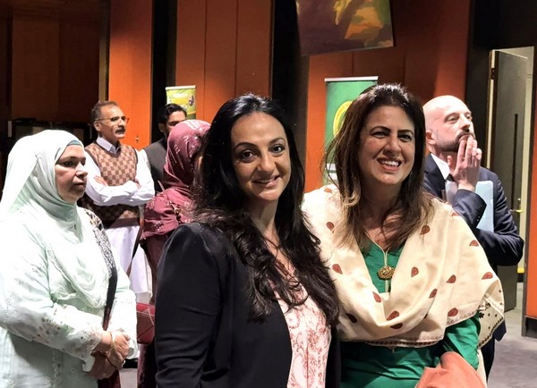 A group of women standing together

AI-generated content may be incorrect.