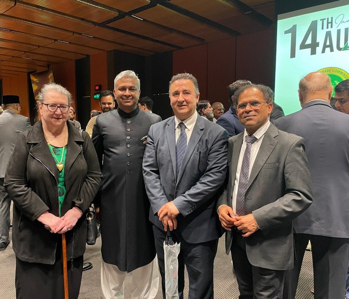 A group of people standing together

AI-generated content may be incorrect.