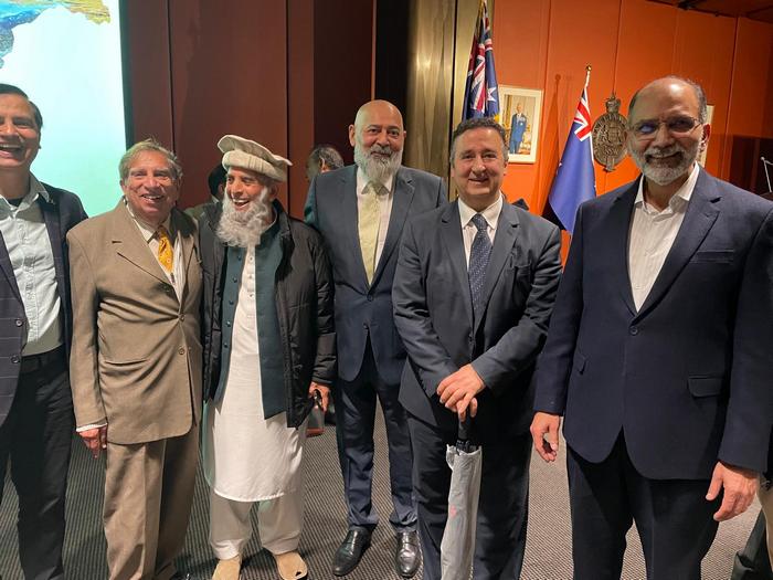 A group of men standing together

AI-generated content may be incorrect.