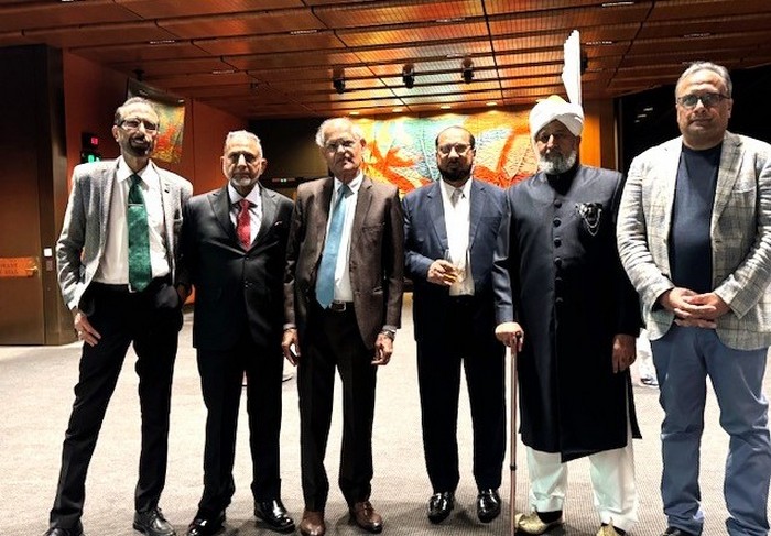 A group of men standing together

AI-generated content may be incorrect.