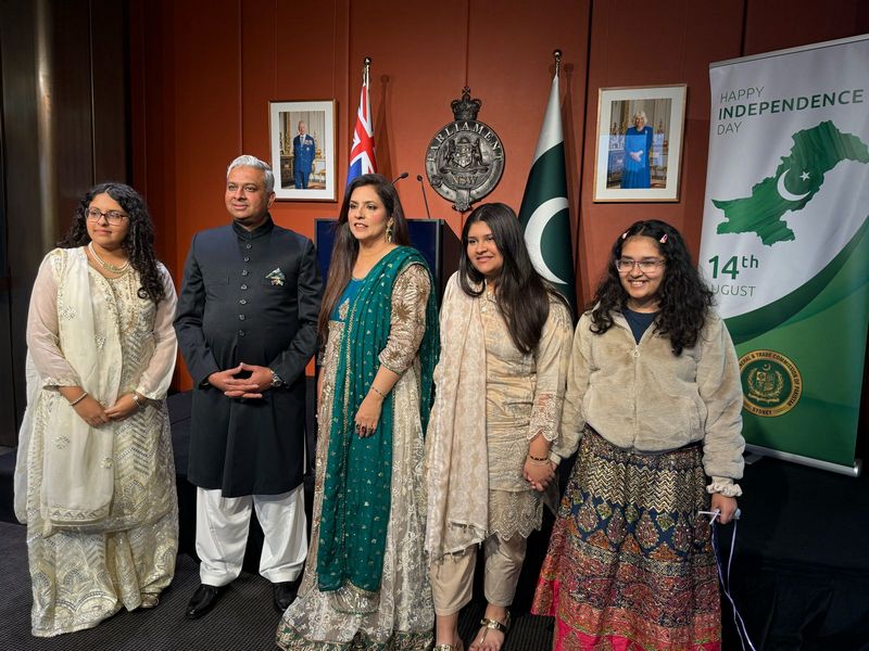 A group of people standing in front of flags

AI-generated content may be incorrect.