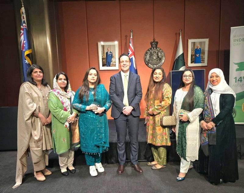 A group of people standing in front of flags

AI-generated content may be incorrect.