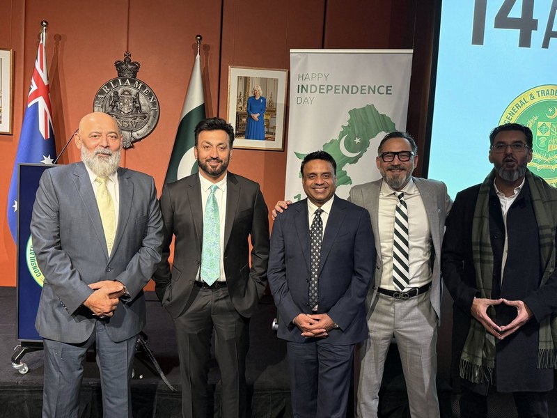 A group of men standing in front of flags

AI-generated content may be incorrect.