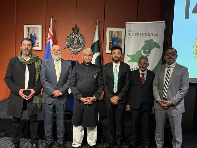 A group of men standing in front of flags

AI-generated content may be incorrect.