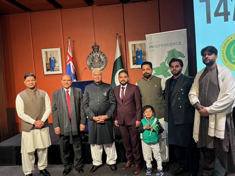 A group of men standing in front of a flag

AI-generated content may be incorrect.