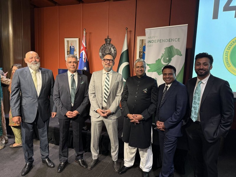 A group of men standing in front of flags

AI-generated content may be incorrect.