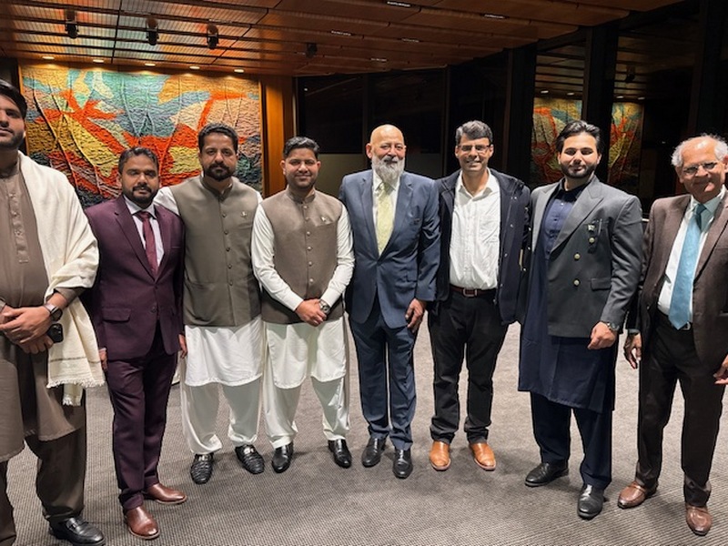 A group of men standing together

AI-generated content may be incorrect.