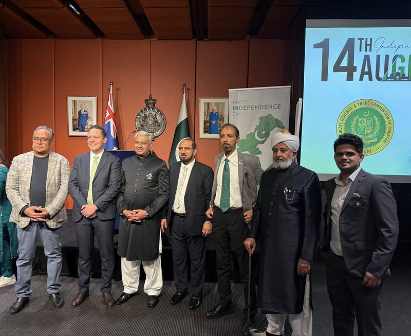 A group of men standing in front of a screen

AI-generated content may be incorrect.