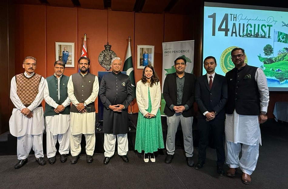 A group of people standing in front of a screen

AI-generated content may be incorrect.