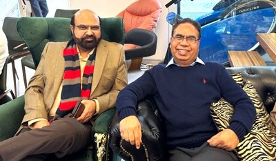 Two men sitting in chairs

AI-generated content may be incorrect.