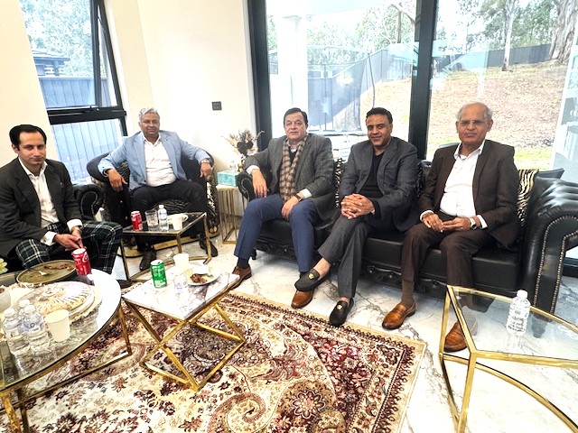 A group of men sitting on a couch

AI-generated content may be incorrect.