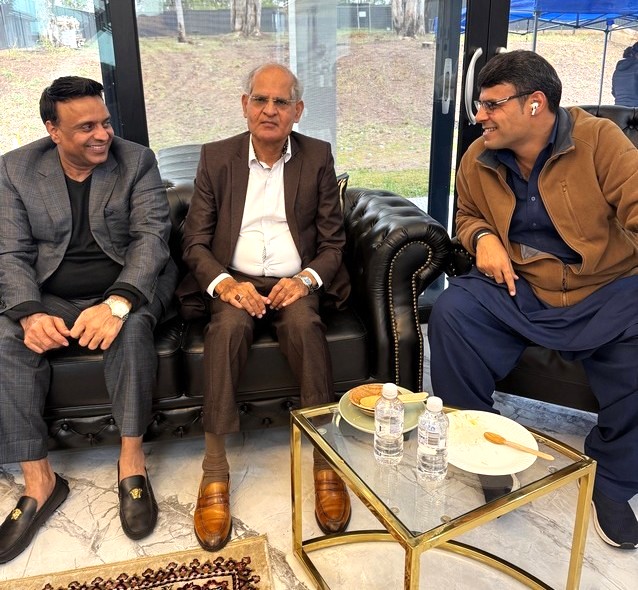 A group of men sitting on a couch

AI-generated content may be incorrect.