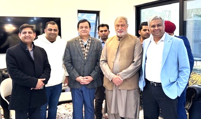 A group of men standing together

AI-generated content may be incorrect.