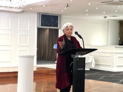 A person standing at a podium

AI-generated content may be incorrect.