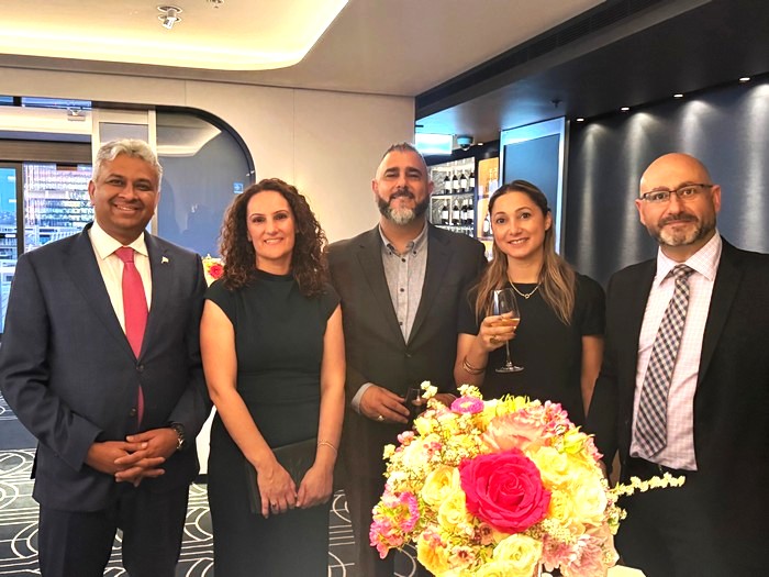 A group of people standing together

AI-generated content may be incorrect.