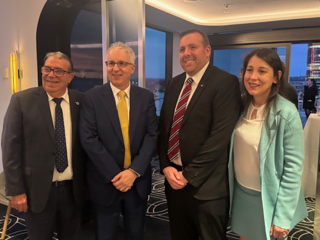 A group of people standing together

AI-generated content may be incorrect.