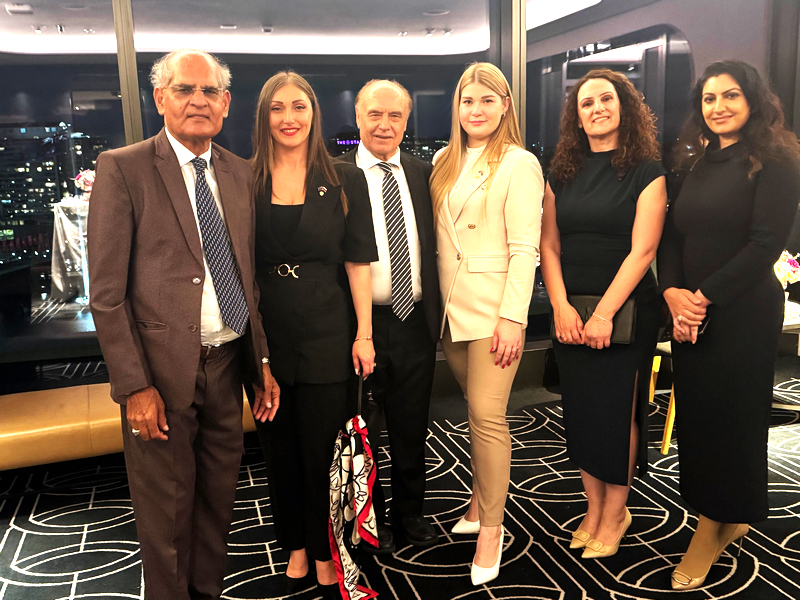 A group of people posing for a photo

AI-generated content may be incorrect.