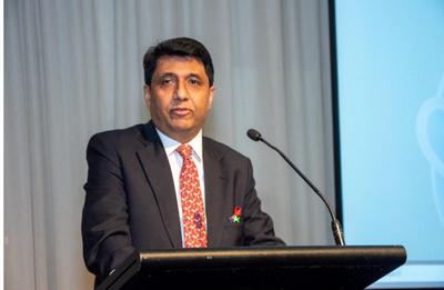 A person standing at a podium

AI-generated content may be incorrect.