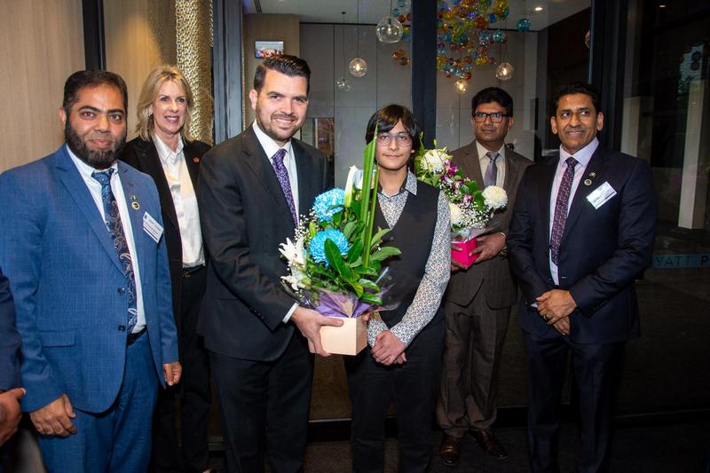 A group of people posing for a photo

AI-generated content may be incorrect.