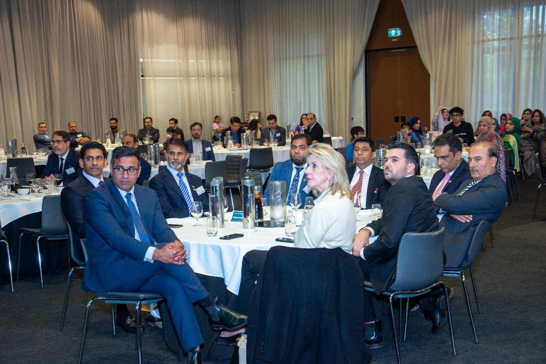 A group of people sitting at tables

AI-generated content may be incorrect.