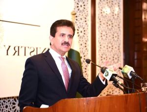 A person standing at a podium with microphones

AI-generated content may be incorrect.